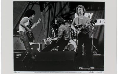 Rory, Phil & Paul - photographic print of Rory Gallagher, Phil Lynott & Paul Brady playing in concert together at Punchestown in 1982, taken & signed by Hot Press Photographer Colm Henry