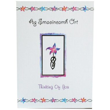 A lovely bilingual Thinking of You Card with a front multicoloural floral image. Designed and printed in Ireland