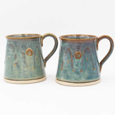 Glás Celtic Mugs, set of 2 cylinder mugs. Unique green colour with Celtic motif. Handmade in Ireland by Castle Arch Pottery.