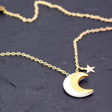 Moon & Star Necklace handmade in Ireland by Danu Ceramics. A white and gold moon with a small magical gold-filled star.